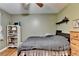 Comfortable bedroom with hardwood floors, shelving and natural light at 3229 Richwood Dr, Duluth, GA 30096