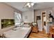 Cozy bedroom featuring natural light, wood floors, and a ceiling fan at 3229 Richwood Dr, Duluth, GA 30096