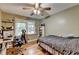Cozy bedroom features hardwood floors and natural light at 3229 Richwood Dr, Duluth, GA 30096
