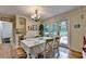 Bright dining room with a chandelier, table with seating, and access to a lovely outdoor space at 3229 Richwood Dr, Duluth, GA 30096