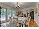 Bright dining area features a table with seating, access to a patio, and classic furnishings for a warm atmosphere at 3229 Richwood Dr, Duluth, GA 30096
