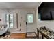 Bright entryway featuring a decorative glass door, hardwood floors, and charming accents for a welcoming ambiance at 3229 Richwood Dr, Duluth, GA 30096