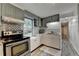 Charming kitchen featuring stainless steel appliances and checkered backsplash at 3229 Richwood Dr, Duluth, GA 30096