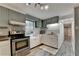Charming kitchen featuring stainless steel appliances and checkered backsplash at 3229 Richwood Dr, Duluth, GA 30096
