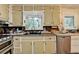 Functional kitchen features stainless steel appliances and garden view windows at 3229 Richwood Dr, Duluth, GA 30096