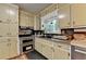 Functional kitchen features stainless steel appliances and garden view windows at 3229 Richwood Dr, Duluth, GA 30096