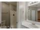 Bathroom featuring shower, sink and toilet with a bright vanity mirror at 6200 Beaver Creek Trl, Atlanta, GA 30349