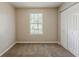 Cozy bedroom featuring carpet and a closet for ample storage at 6200 Beaver Creek Trl, Atlanta, GA 30349