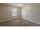 Bedroom featuring plush carpet and a window for natural light at 6200 Beaver Creek Trl, Atlanta, GA 30349