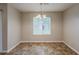 Bright dining area with tile floors and a chandelier with a window view at 6200 Beaver Creek Trl, Atlanta, GA 30349