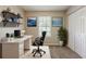 Functional home office with sleek desk, ergonomic chair, ample storage, and a bright window at 6200 Beaver Creek Trl, Atlanta, GA 30349