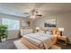 Serene main bedroom featuring a modern bed, soft lighting, dresser and large windows with natural light at 6200 Beaver Creek Trl, Atlanta, GA 30349