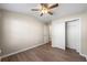 Bedroom featuring wood floors, fan, and closet at 213 Riverstone Commons Cir, Canton, GA 30114