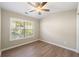 Bedroom featuring wood floors, large window, and ample natural light at 213 Riverstone Commons Cir, Canton, GA 30114