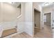 Bright townhome foyer with staircase, closet and wood flooring at 213 Riverstone Commons Cir, Canton, GA 30114