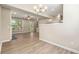 Bright, open living space with hardwood floors, neutral walls, and abundant natural light at 213 Riverstone Commons Cir, Canton, GA 30114