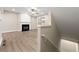 Living room with a fireplace, wood flooring, and neutral paint at 213 Riverstone Commons Cir, Canton, GA 30114