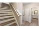 Staircase leading to the townhome's upper level with an adjacent bathroom at 213 Riverstone Commons Cir, Canton, GA 30114