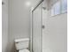 Bathroom featuring a glass enclosed shower and toilet with natural light at 2849 Snapfinger Rd, Decatur, GA 30034