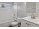 A white bathroom with a shower/tub combination and a bright vanity sink at 2849 Snapfinger Rd, Decatur, GA 30034