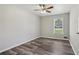 Bedroom featuring natural light, wood-look floors, neutral paint, and a ceiling fan at 2849 Snapfinger Rd, Decatur, GA 30034