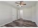 A bright bedroom with wood-look floors and a ceiling fan offers ample closet space at 2849 Snapfinger Rd, Decatur, GA 30034
