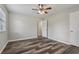Bright bedroom with wood-look floors, neutral paint, and a ceiling fan at 2849 Snapfinger Rd, Decatur, GA 30034
