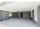 Spacious carport with a gray painted floor and brick walls at 2849 Snapfinger Rd, Decatur, GA 30034