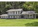 Charming two-story home featuring gray paint, white shutters, and a well-manicured lawn at 2849 Snapfinger Rd, Decatur, GA 30034