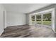 Bright living room with a large bay window and wood grain vinyl plank floors at 2849 Snapfinger Rd, Decatur, GA 30034