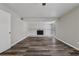 Open living room featuring a white fireplace and sleek, modern flooring at 2849 Snapfinger Rd, Decatur, GA 30034