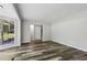 Open living room with large window and wood grain vinyl plank floors at 2849 Snapfinger Rd, Decatur, GA 30034