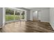 Bright living room with large bay window and wood grain vinyl plank floors at 2849 Snapfinger Rd, Decatur, GA 30034