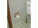 Powder room features a toilet and a toilet paper holder on a tiled floor at 340 Sherwood Se Cir, Conyers, GA 30094