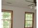 Bedroom with two double hung windows and a ceiling fan with light fixture at 340 Sherwood Se Cir, Conyers, GA 30094