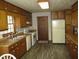 Functional kitchen featuring wood cabinets, modern appliances, and durable flooring at 340 Sherwood Se Cir, Conyers, GA 30094