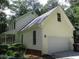 Exterior side view of a home showcasing the attached garage, clean lines, and well-maintained siding at 340 Sherwood Se Cir, Conyers, GA 30094