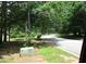 Neighborhood street view with mature trees and a glimpse of the home's setting at 340 Sherwood Se Cir, Conyers, GA 30094