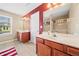 Bright bathroom with double sink vanity and a separate glass shower at 44 Providence Oak Ct, Lawrenceville, GA 30046
