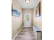 Bright foyer features wood floors, a front door with window, bench, and stylish decor at 44 Providence Oak Ct, Lawrenceville, GA 30046