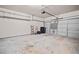 Spacious garage with shelving and a multi-panel garage door at 44 Providence Oak Ct, Lawrenceville, GA 30046