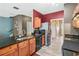 Modern kitchen features stainless steel appliances, granite countertops, and wood cabinets at 44 Providence Oak Ct, Lawrenceville, GA 30046
