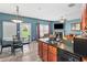 Open concept living space with kitchen island, dining area, and comfortable furniture at 44 Providence Oak Ct, Lawrenceville, GA 30046