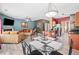 Open-concept living area features a fireplace, dining table, and kitchen at 44 Providence Oak Ct, Lawrenceville, GA 30046