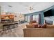 Open-concept living space features a kitchen with bar seating, dining area, and living room at 44 Providence Oak Ct, Lawrenceville, GA 30046