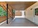 View of a covered deck with stairs leading to the backyard area at 5245 Cottage Farm Rd, Johns Creek, GA 30022