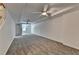 Large basement with neutral walls and carpet, ceiling fan, and a window at 5245 Cottage Farm Rd, Johns Creek, GA 30022