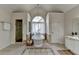 Bright bathroom features a soaking tub under an arched window and a glass-enclosed shower at 5245 Cottage Farm Rd, Johns Creek, GA 30022
