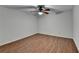 Bedroom with wood floors, neutral walls, and a modern ceiling fan at 5245 Cottage Farm Rd, Johns Creek, GA 30022