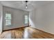 Bright bedroom with hardwood floors and two windows at 5245 Cottage Farm Rd, Johns Creek, GA 30022